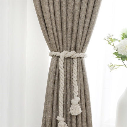 Tmavě béžový elegantní závěs do obýváku