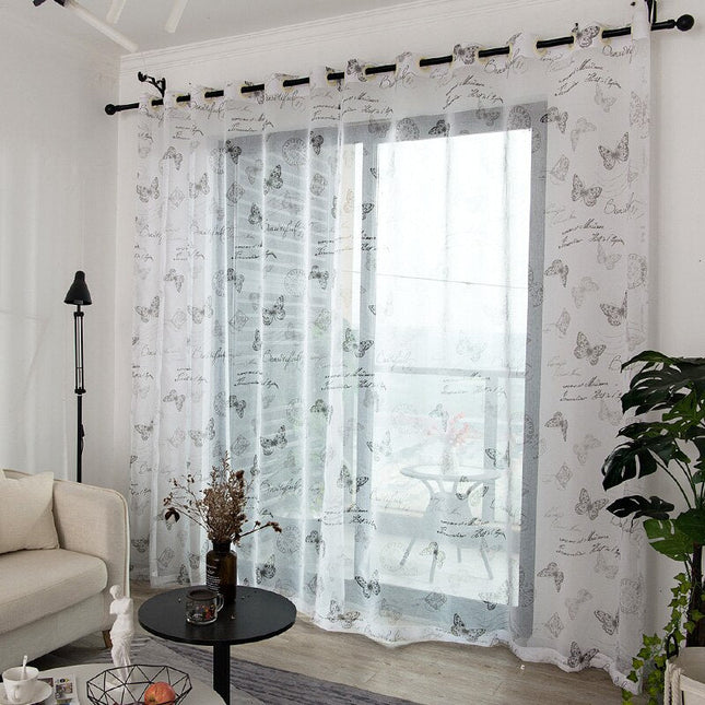 Průsvitná záclona se vzorem motýlů