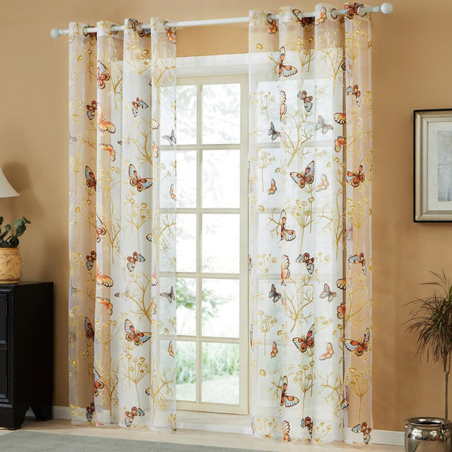 Záclona s vyšívanými barevnými motýly