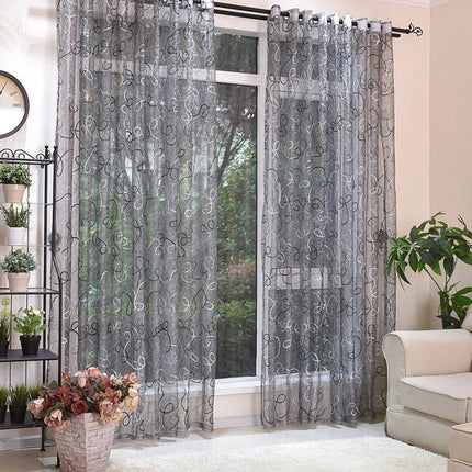 Šedá záclona s abstraktní výšivkou